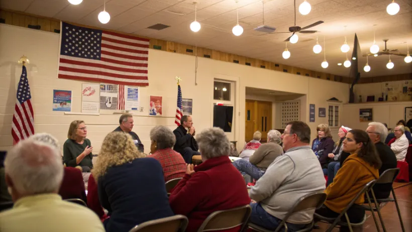 Citizens gathered at a town hall meeting discussing constitutional rights